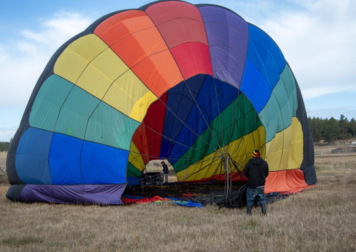 black hills balloons crew getting the hot air balloon ready for launch