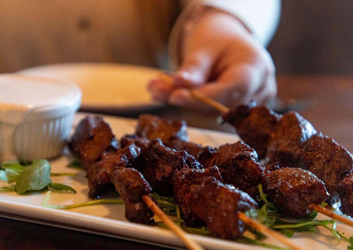plate of chislic skewers with dipping sauce