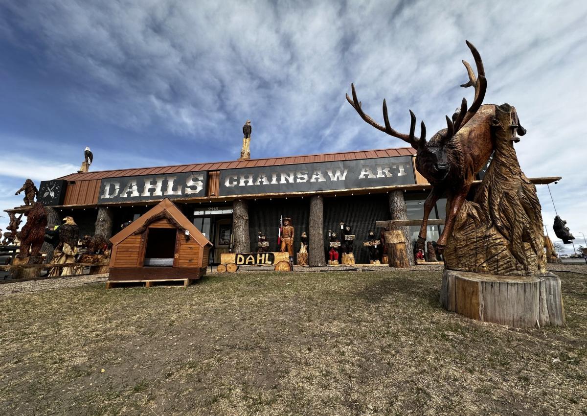 rapid city's dahl's chainsaw art with creations showcased outside the building