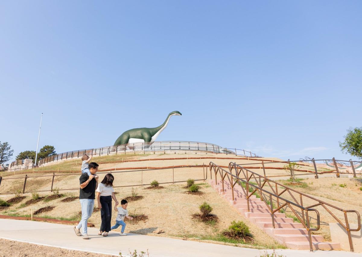 family walking the accessible trail now available at dinosaur park in rapid city, sd