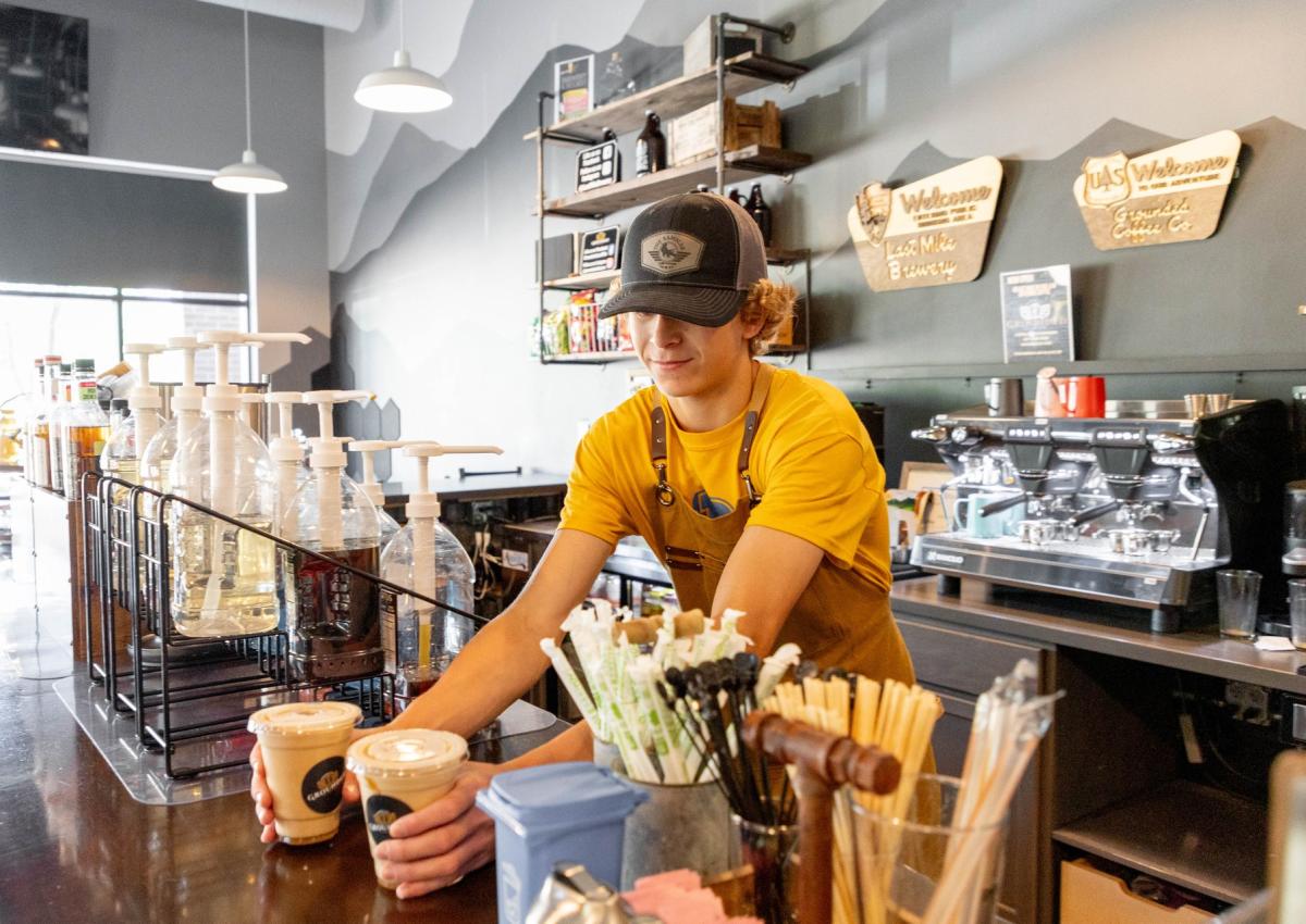 barista setting down coffees on counter at grounded coffee co in Rapid City, sd