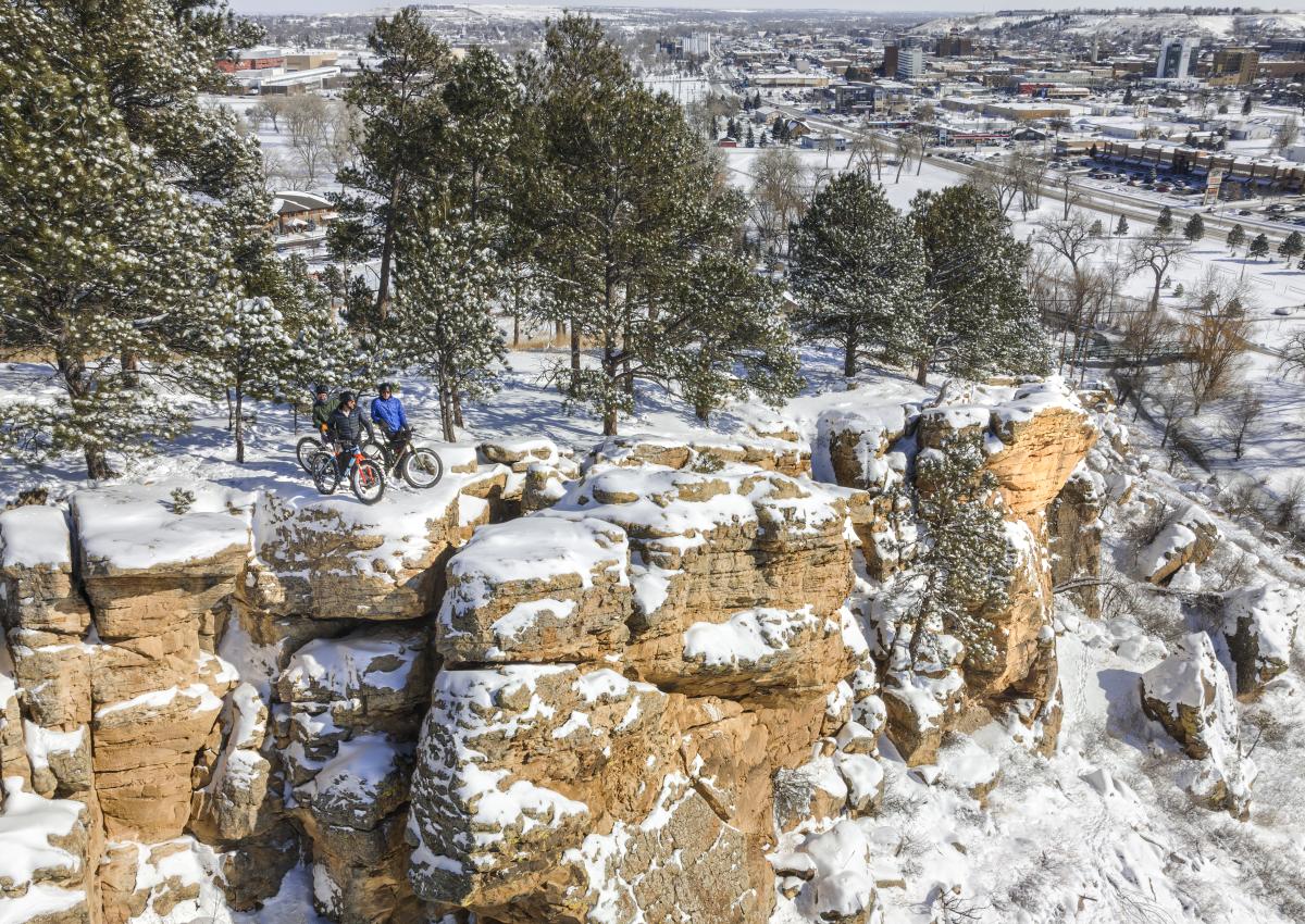 fat tire bikers at the overlook of a trail on hanson larsen memorial park in rapid city, sd