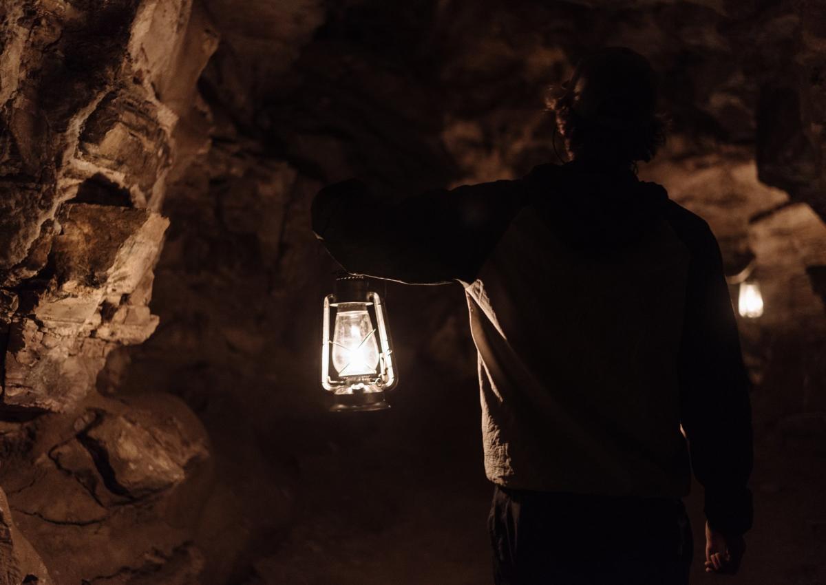 guided cave tour using candle light at jewel cave national monument in south dakota