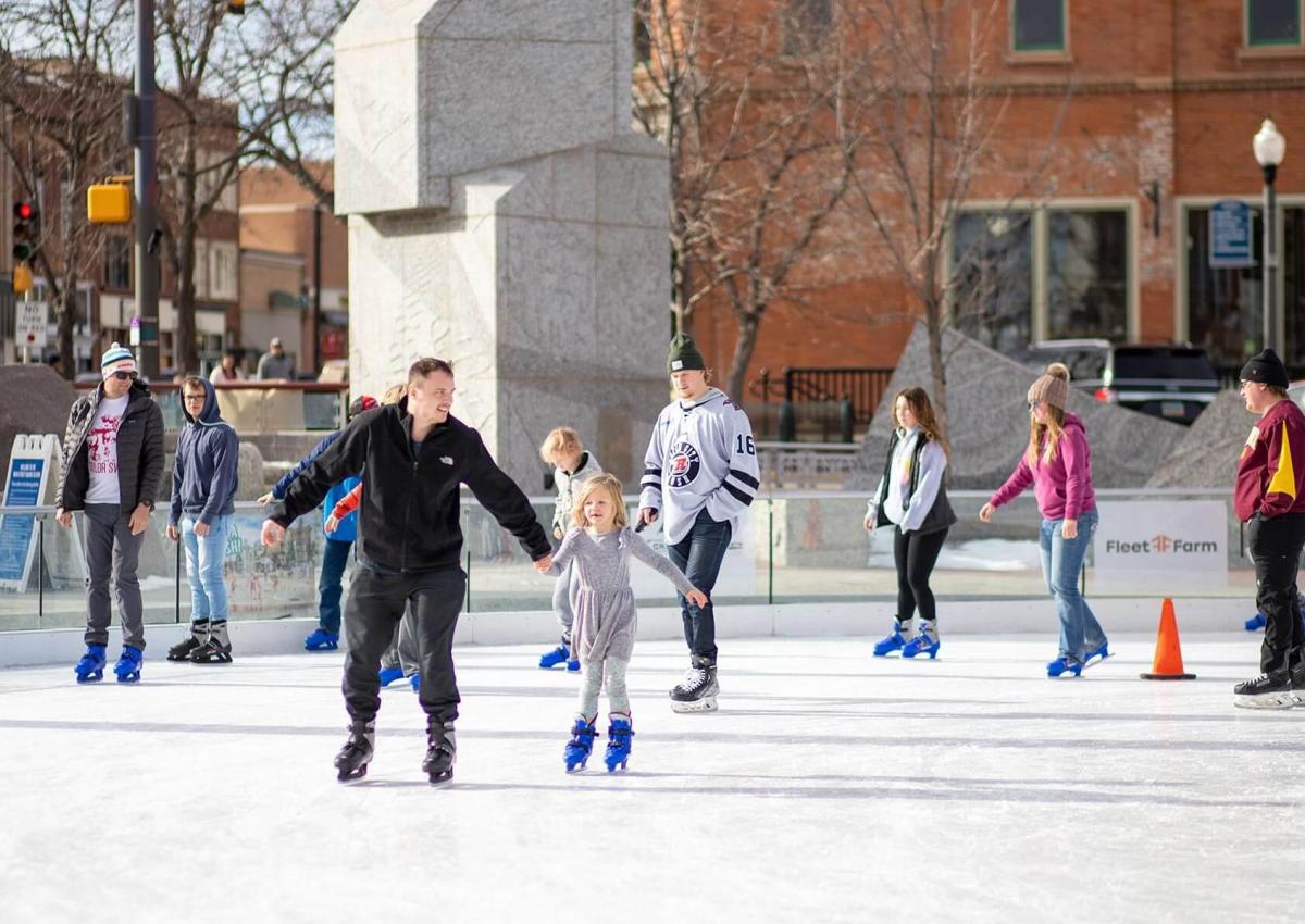 people ice skating on a warm day at main street square in rapid city south dakota