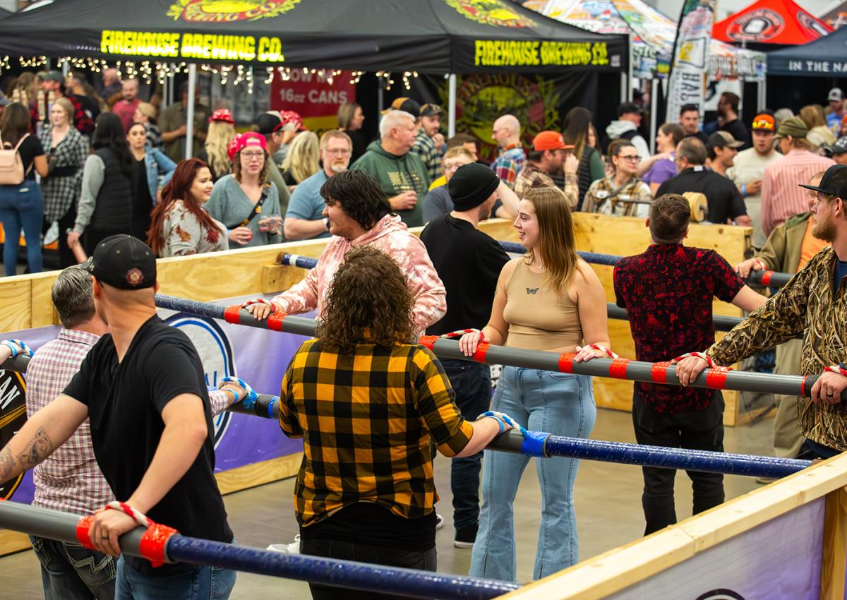 event goers playing human foosball at the mountain west beer fest in rapid city, sd