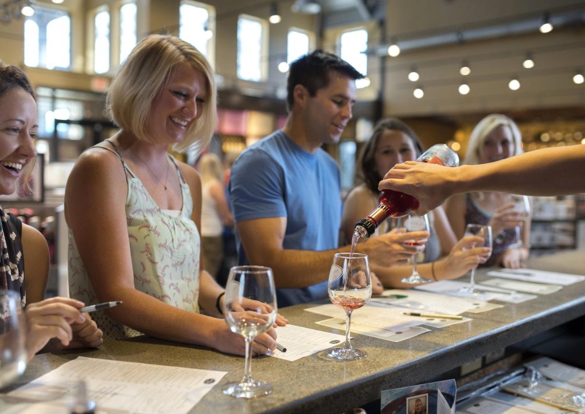 visitors enjoying a wine sampling at prairie berry winery in hill city,sd