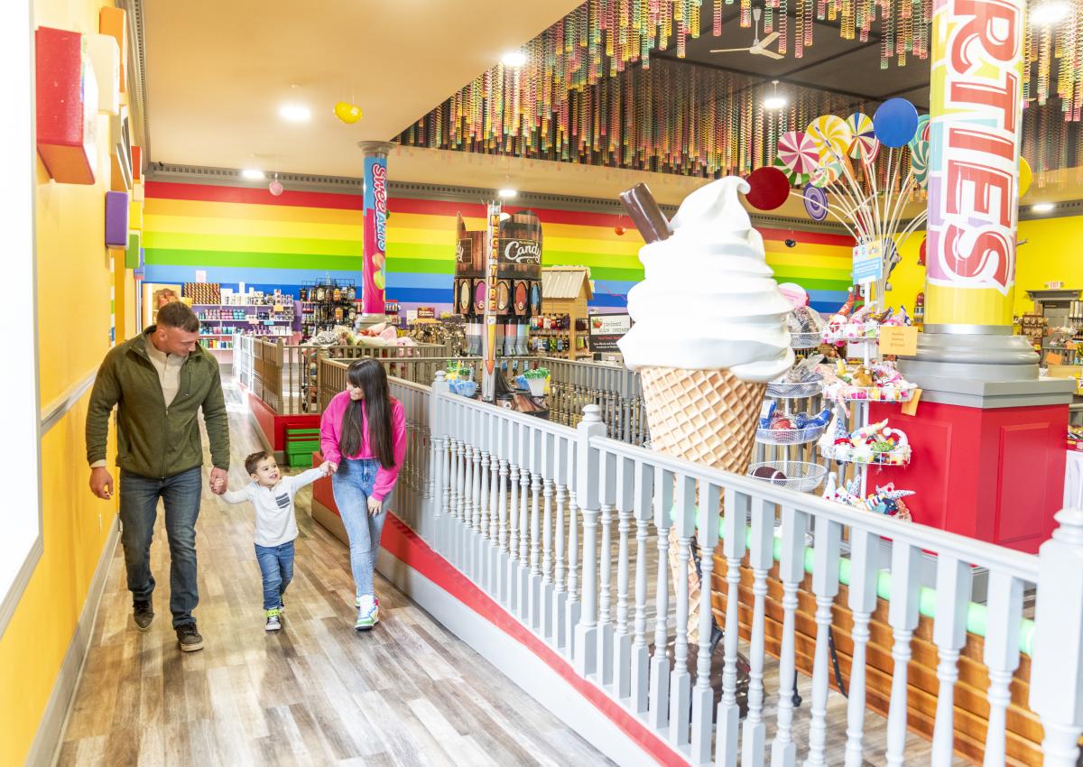 family walking inside rushmore candy company with large selection in rapid city sd