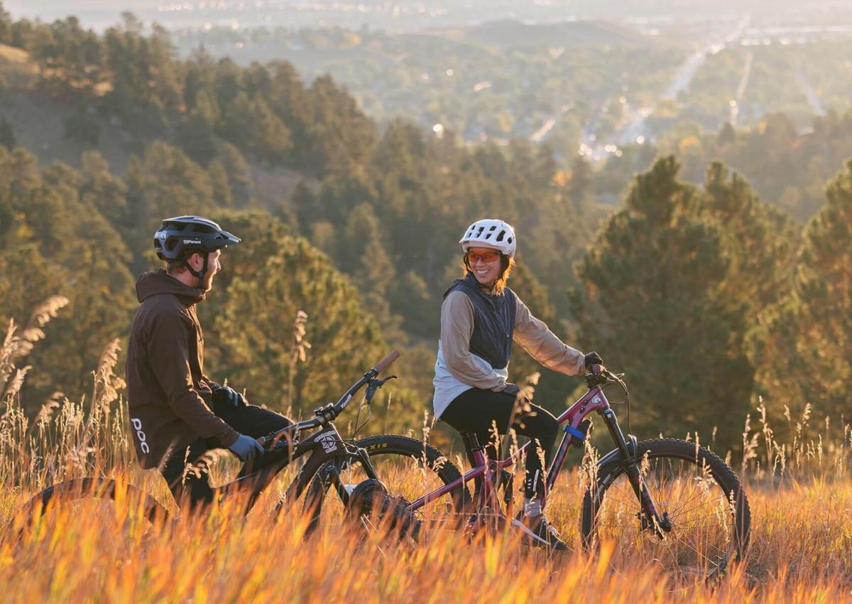 sunrise mountain bikers on the trails overlooking rapid city at skyline wildernes area
