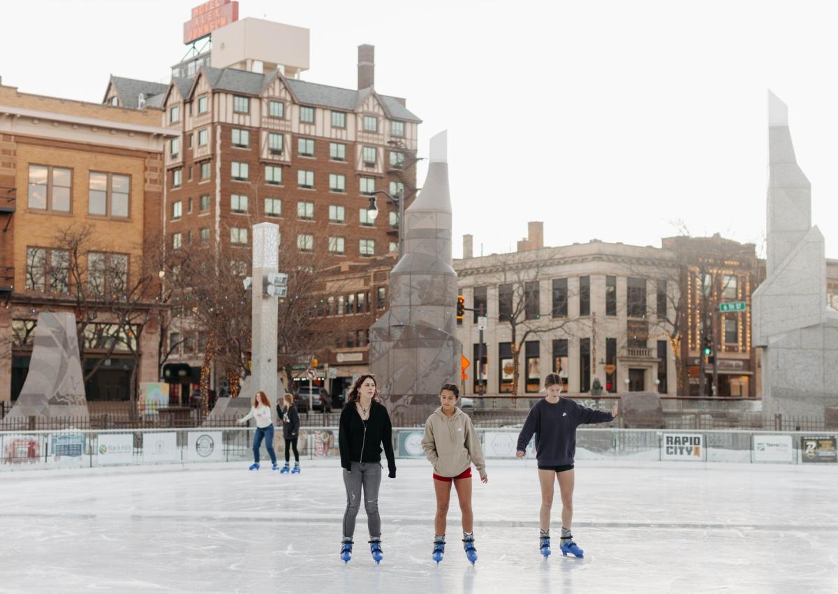 people ice skating in shorts in the winter in rapid city, sd