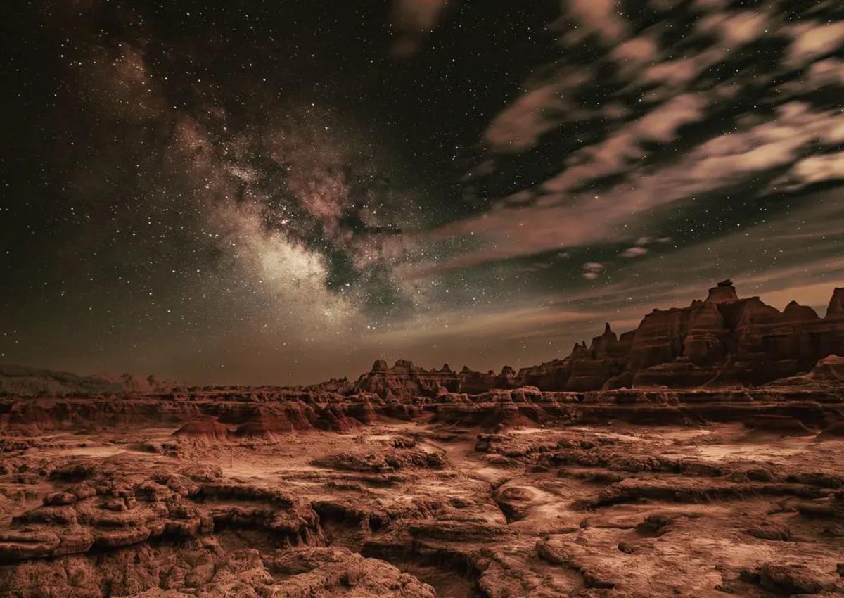 star gazing in badlands national park with clouds and badland formations