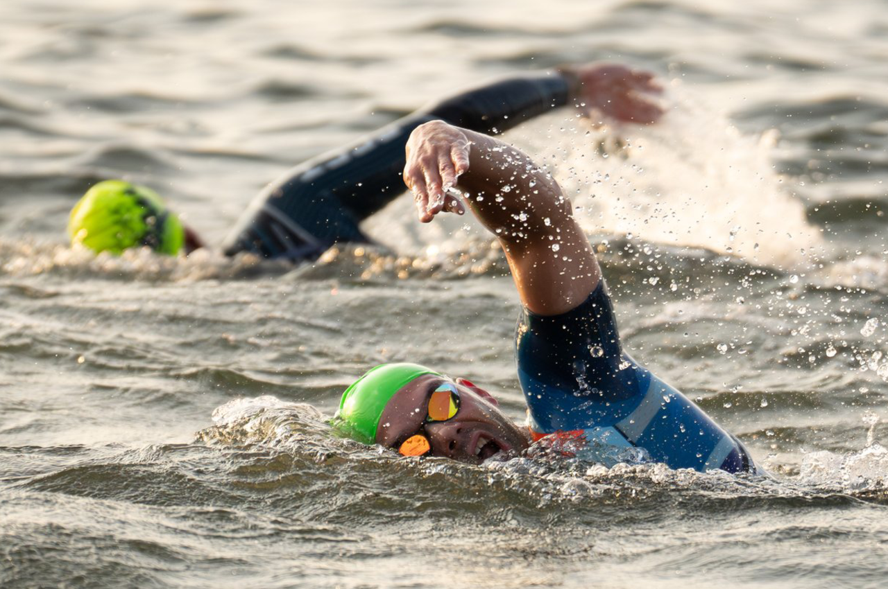 Athletes swimming during Ironman competition