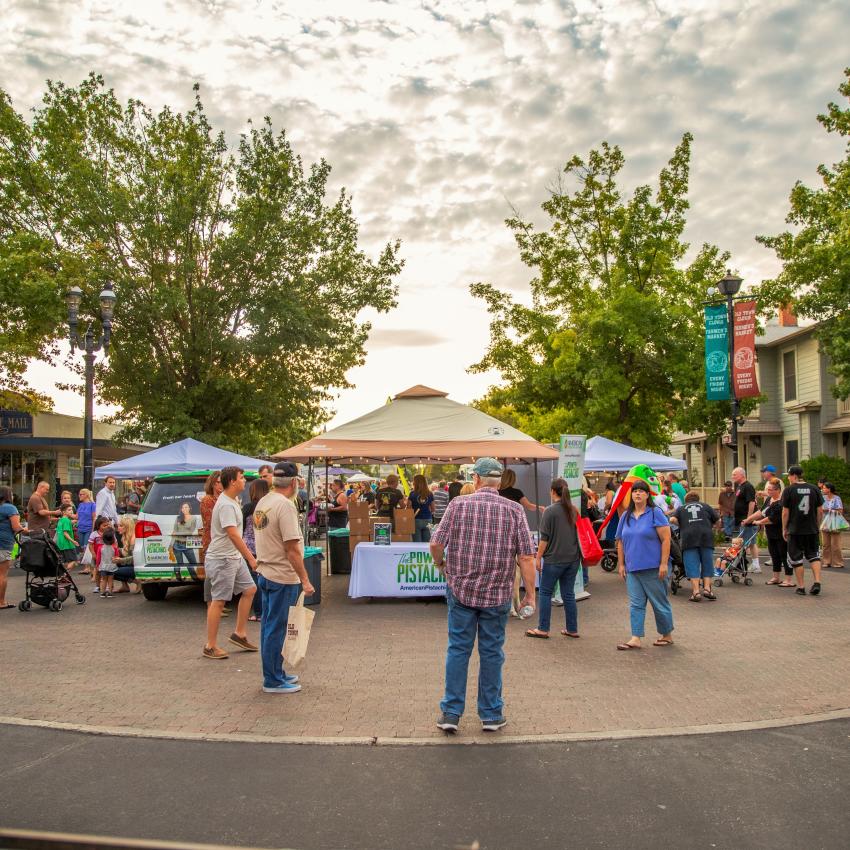 Customers shop at vendor booths at Old Town Clovis Farmers Market