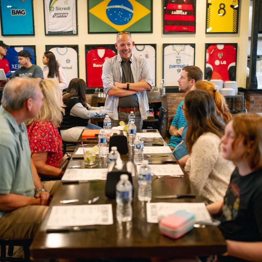 Group sitting at restaurant during a Columbus Food Adventures' tour