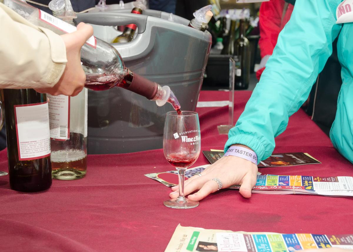 Pouring a taste at Wine in the Woods 