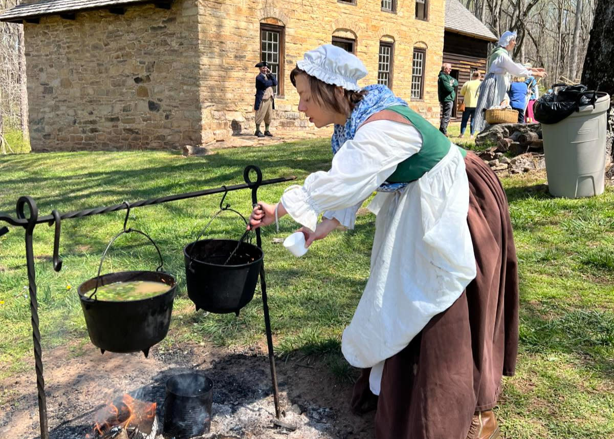 Colonial woman cooking at German Fest