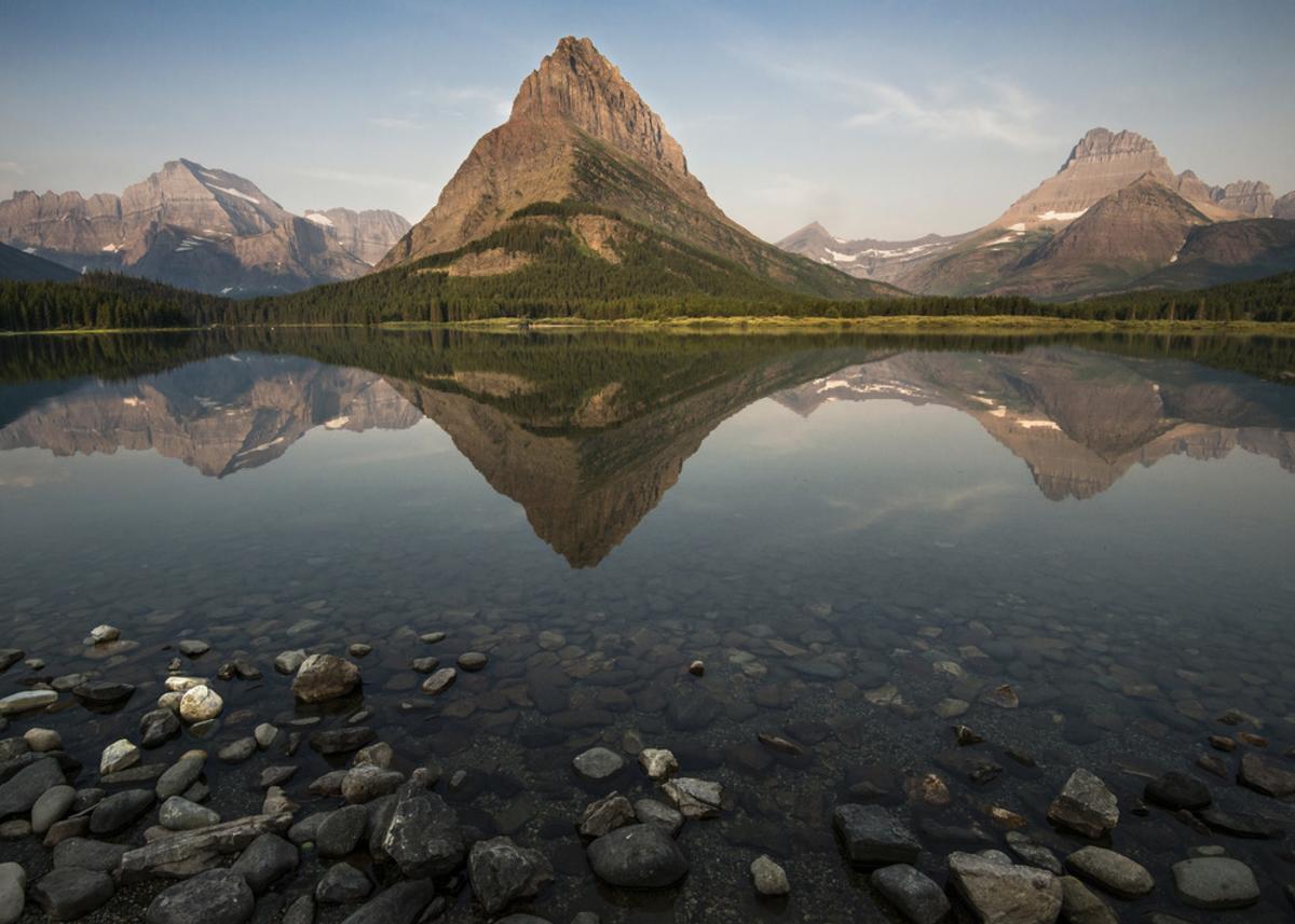 View Of A Mountain Reflected In A Lake At Glacier National Park