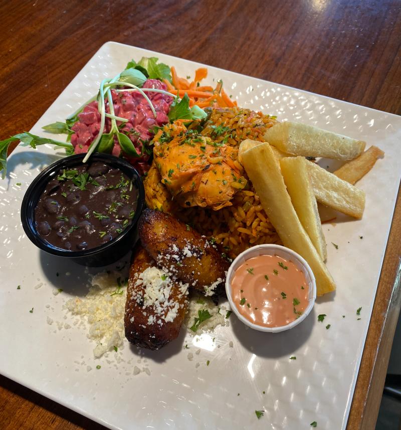 Arroz con pollo dish at Buen Provecho