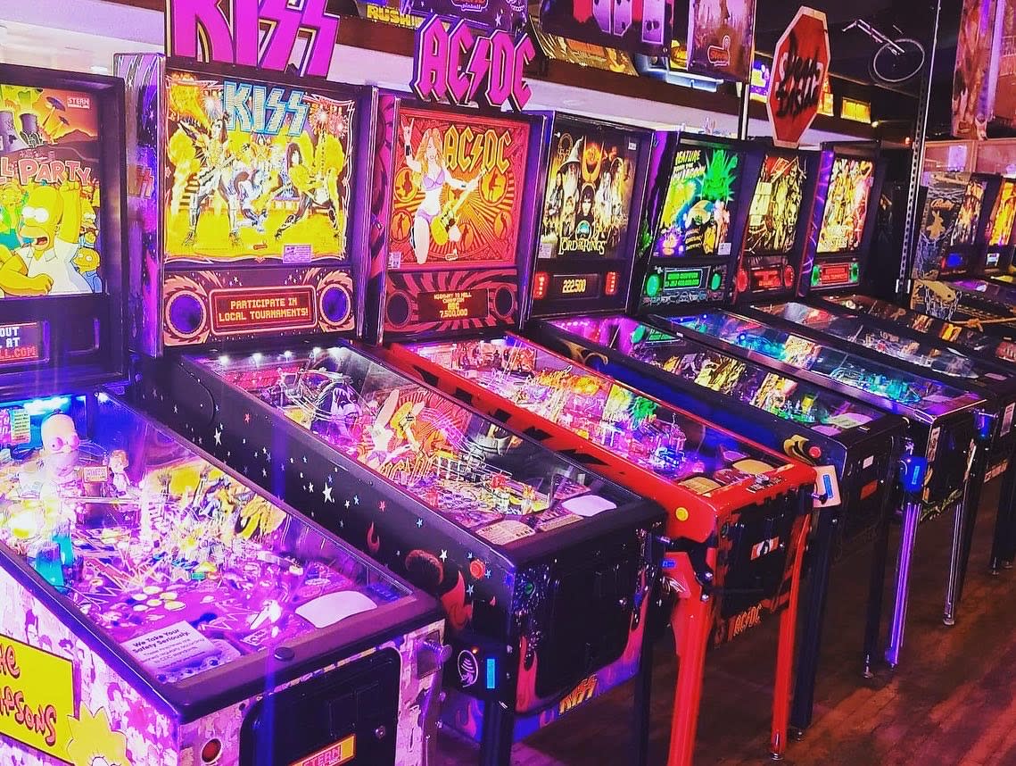 Colorful pinball machines at Flippers Family Arcade, a top indoor kid-friendly activity in Cheyenne, WY.