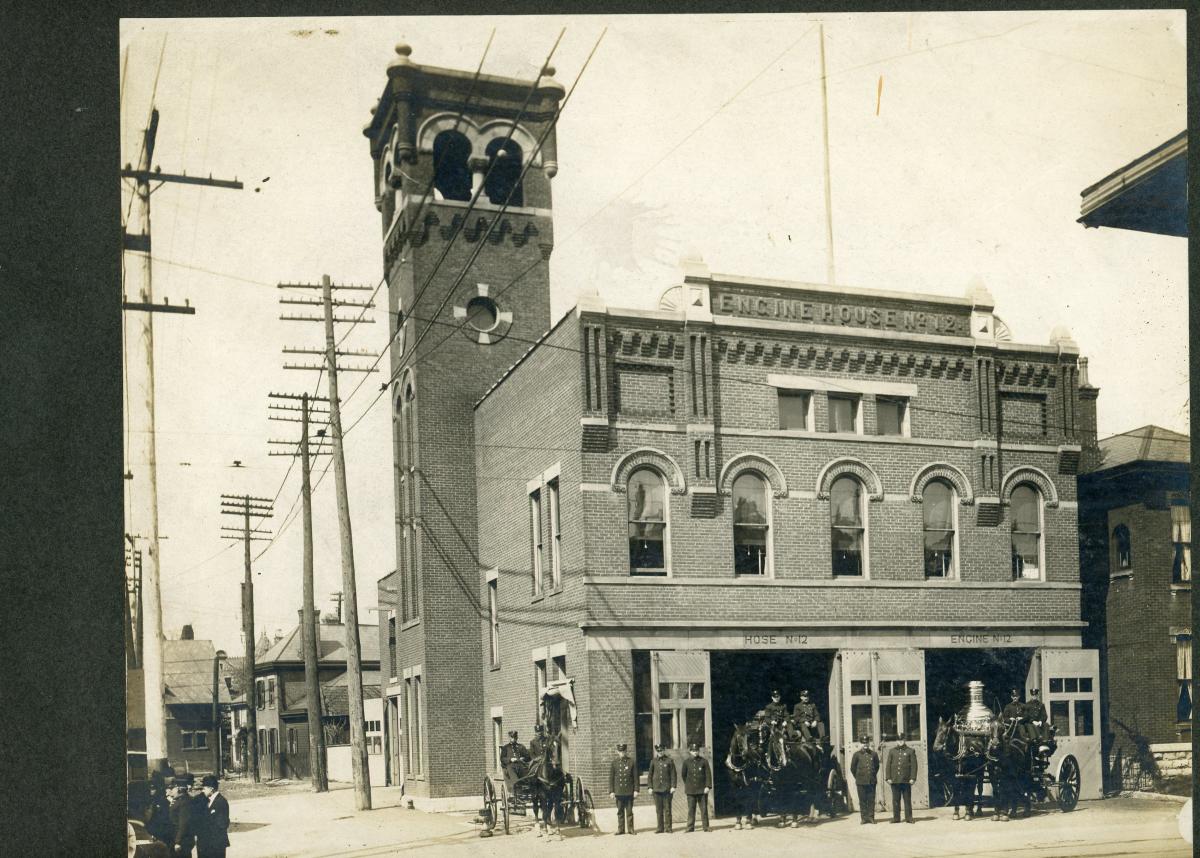 Firehouse #12 brigade poses outside of building that now houses Gemut Beirgarten