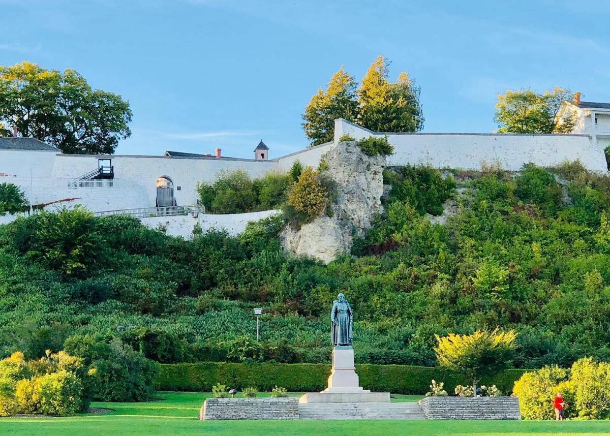 Fort Mackinac looms above Mackinac Island’s Marquette Park and statue of Father Jacques Marquette