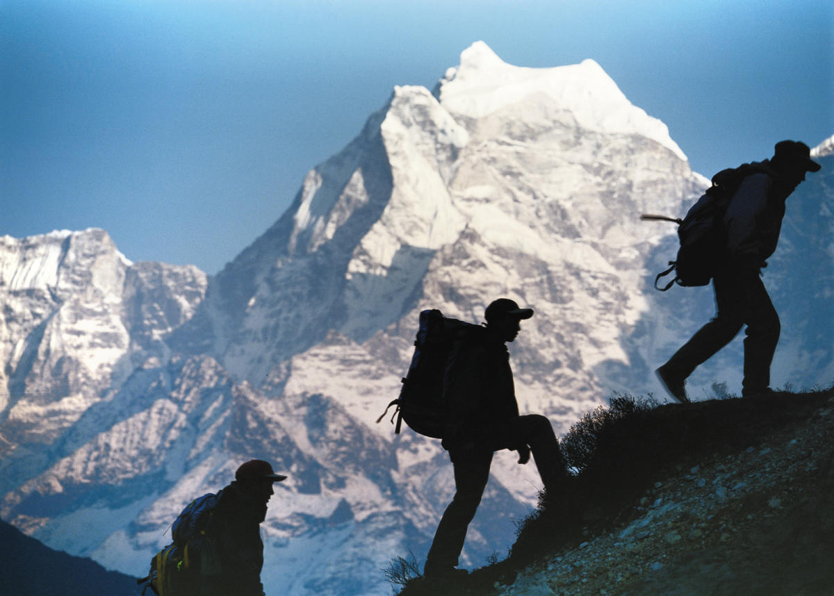 Hikers trek up to the top of Everest in an picture promoting the Everest film in the Dome Theater at Exploration Place