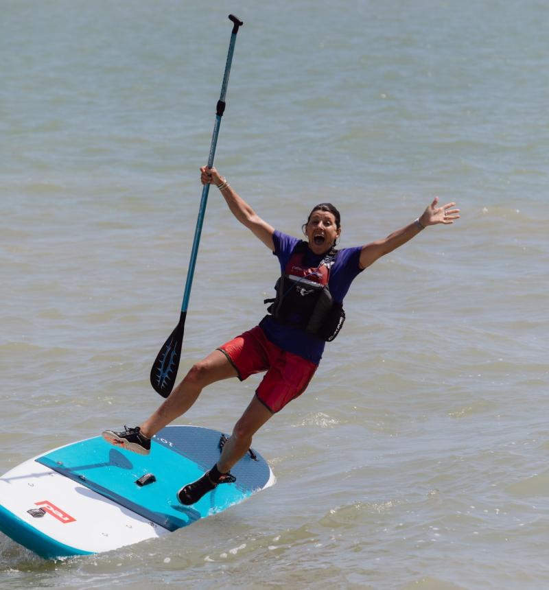 Sam falling from her paddleboard