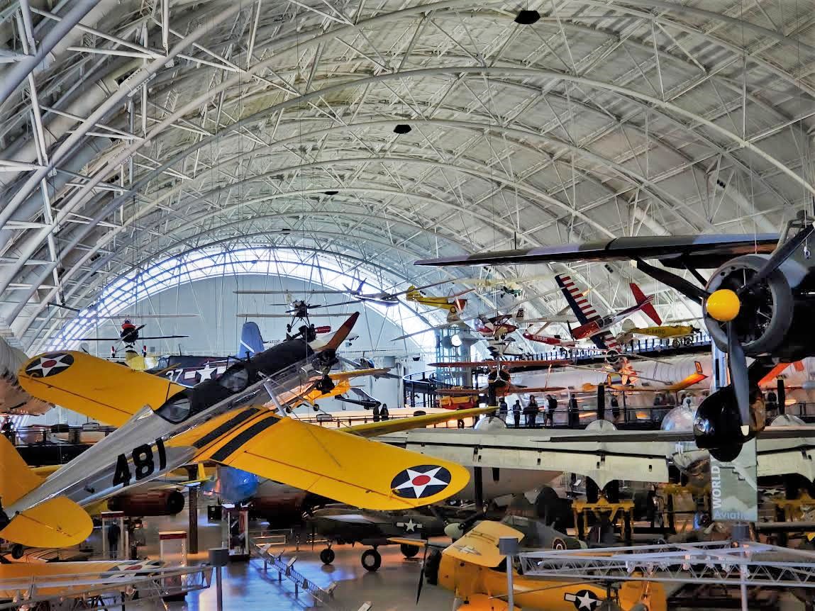 Aerial photograph of the various planes and and aircraft hanging in the hangar space at the Air and Space Museum