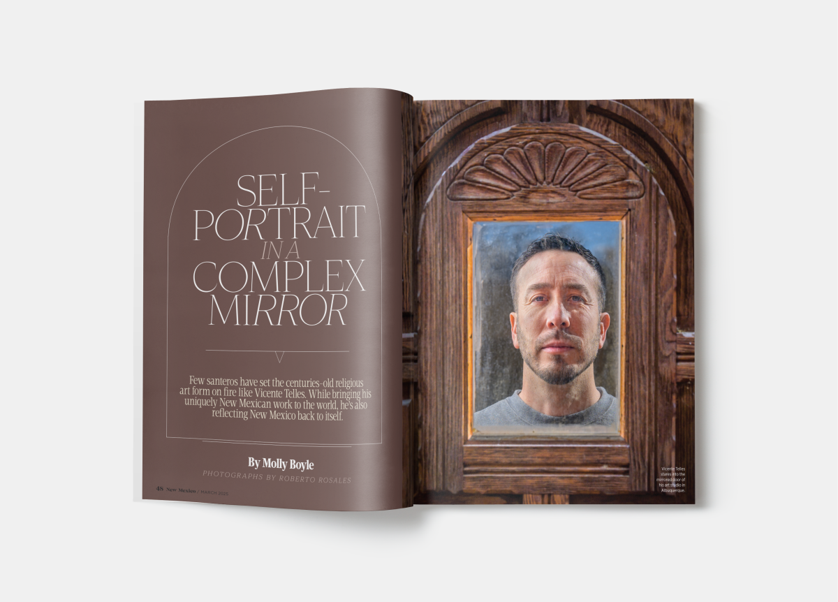 Magazine spread with a wooden-framed mirror showing a person’s reflection beside the title “Self-Portrait in a Complex Mirror.”