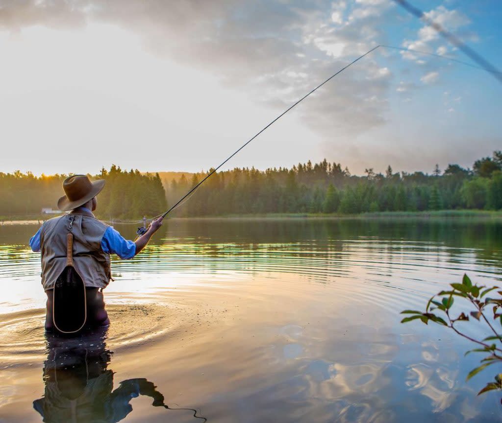 Man fishing in beautiful inland lake