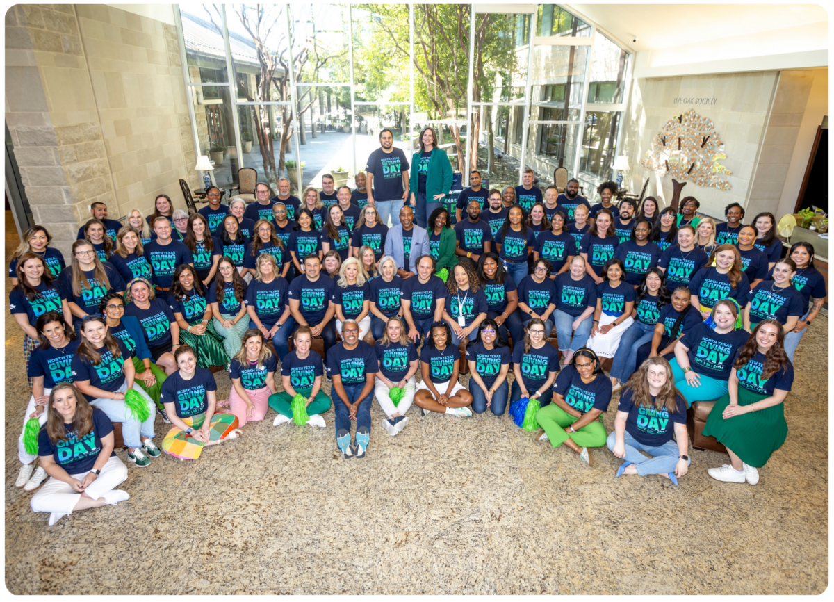 Group of staff posing for a group picture for North Texas Giving Day