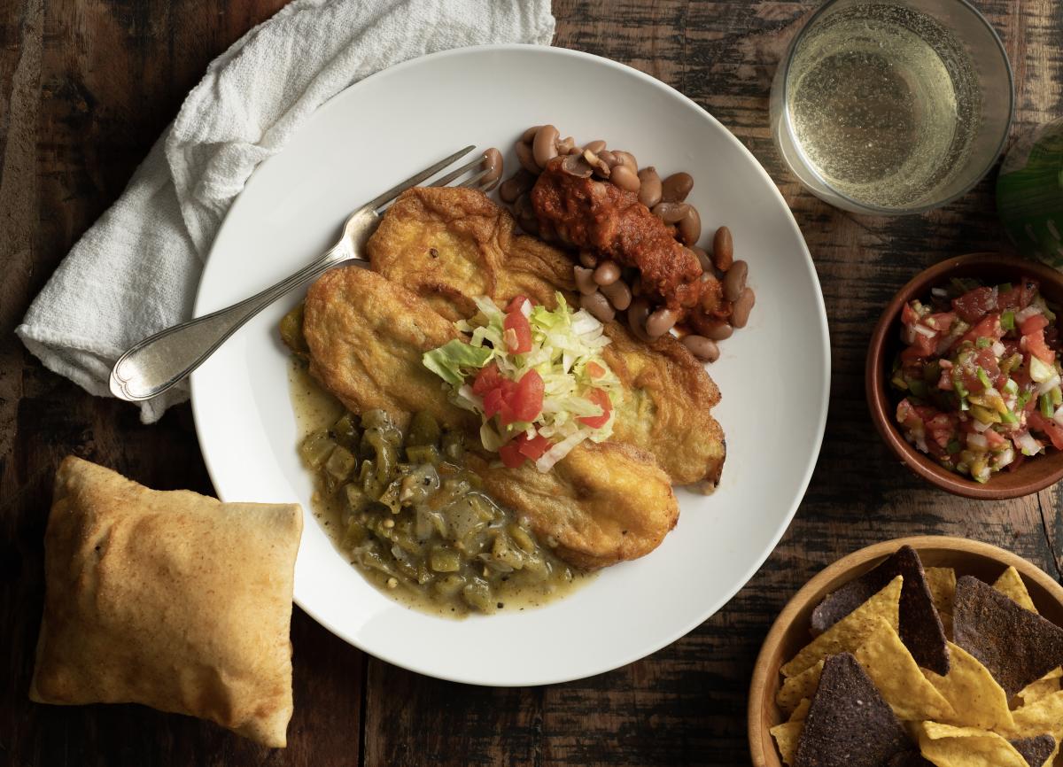 Light, fluffy chile rellenos smothered in your choice of house sace.