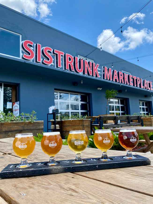 A flight of beers on the patio at Sistrunk Marketplace in Fort Lauderdale, FL.