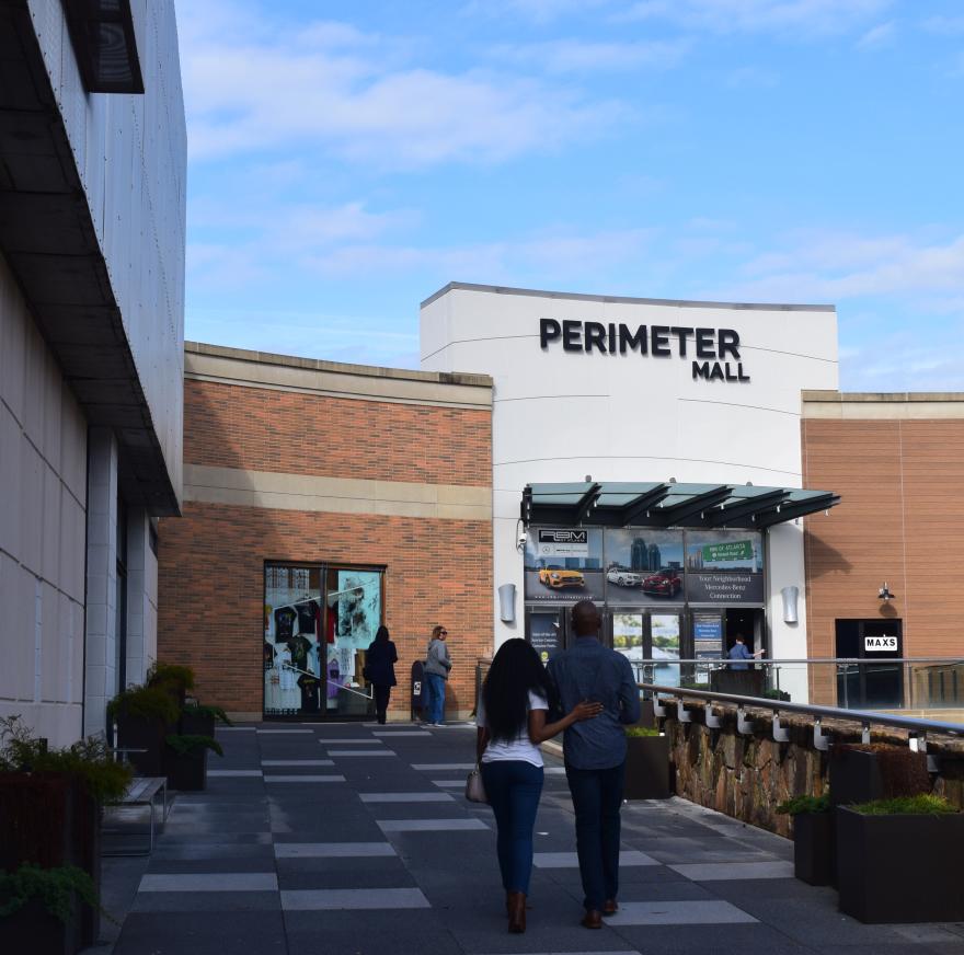 Couple at The Front Entrance Of Perimeter Mall In Dunwoody, GA