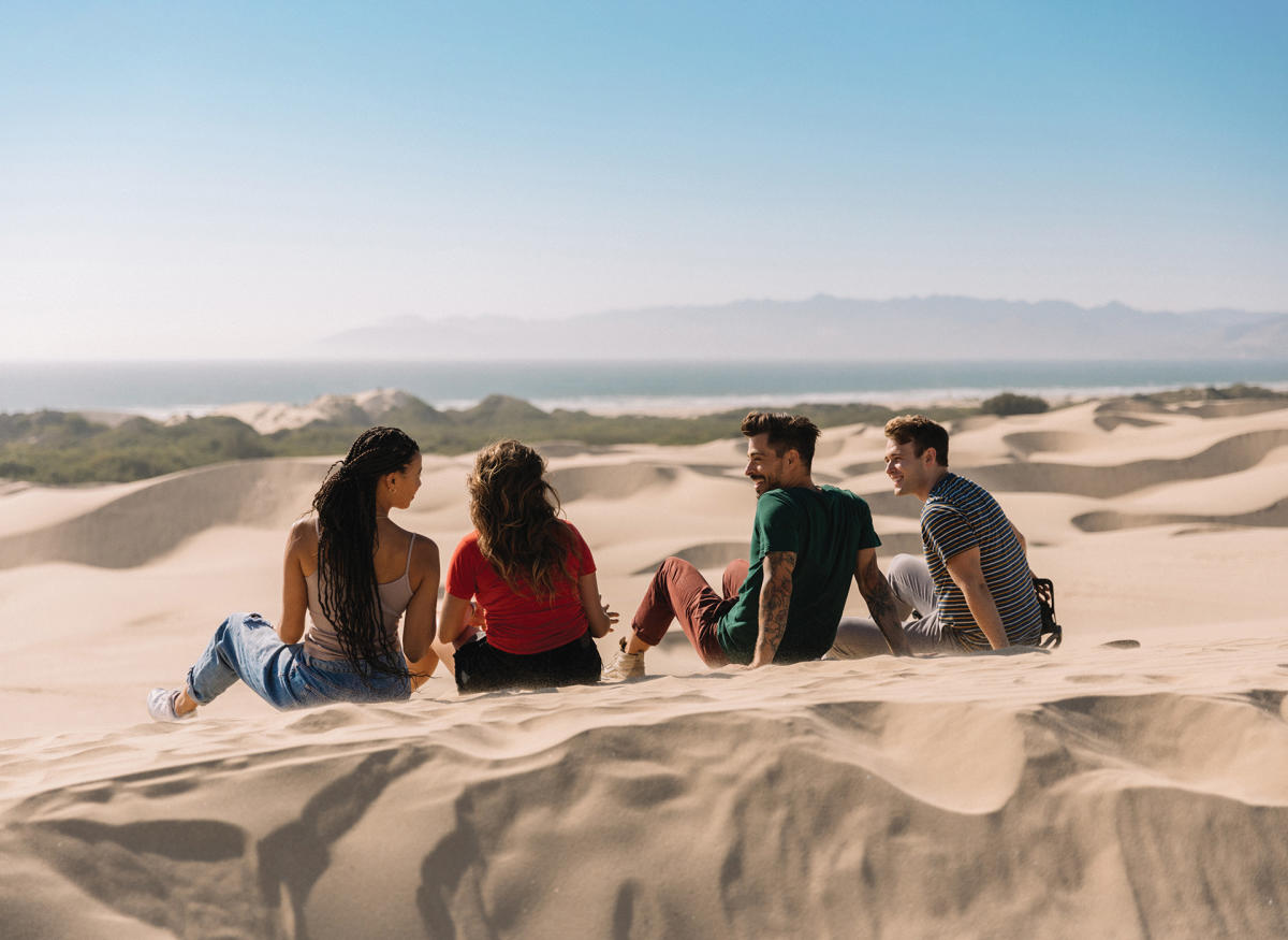 Friends sitting on the Oceano Dunes