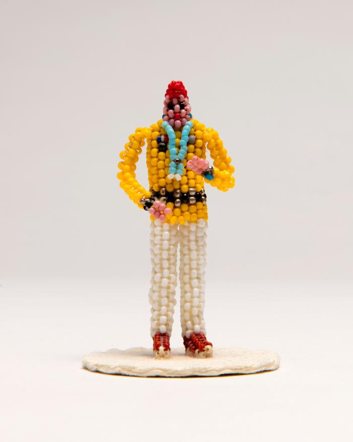 Sheila Antonio’s (Diné) Figurine depicts a beaded World War II code talker.