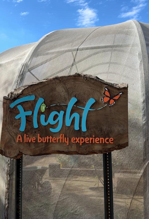 Entrance sign for Flight: A Live Butterfly Experience at Santa Ana Zoo