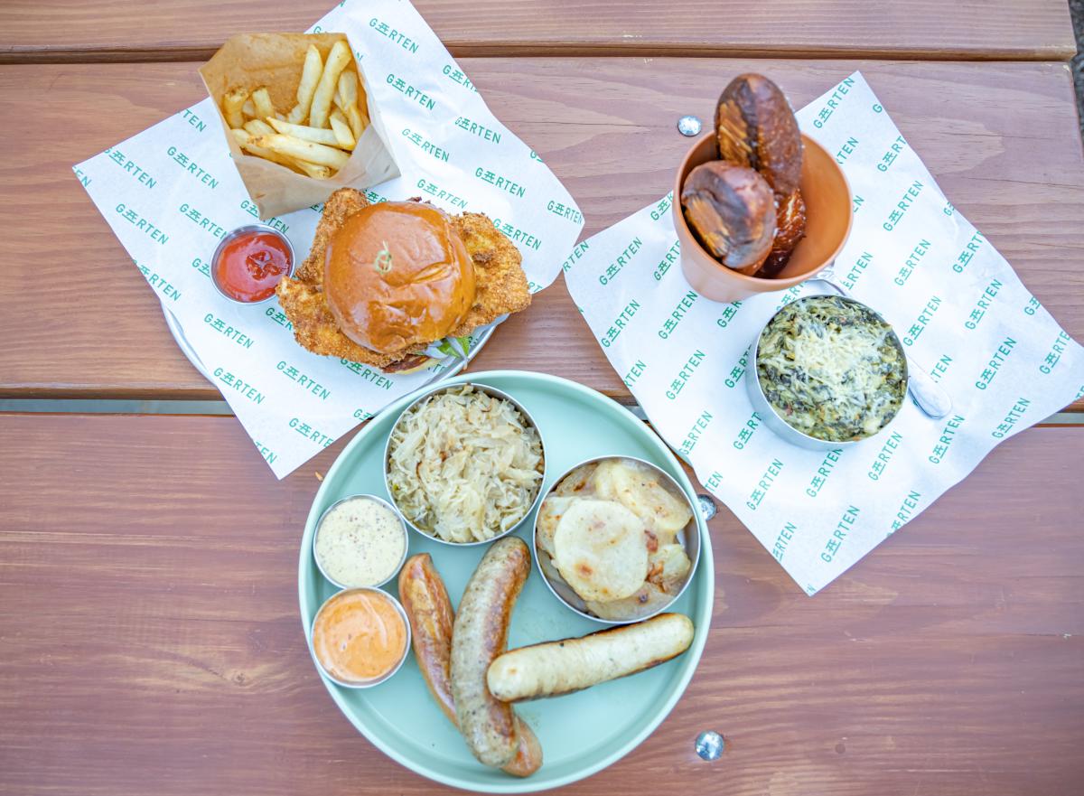 several dishes from the restaurant Garten in Severna Park maryland paid out on a picnic table