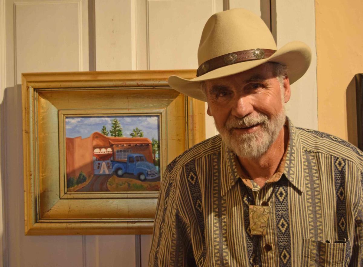 Jack McGowan with one of his many paintings