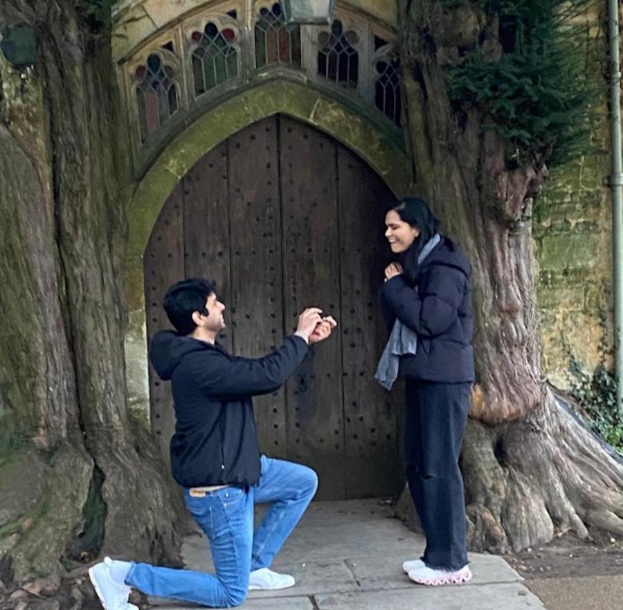A man down on one knee proposing to his girlfriend with Go Cotswolds tours