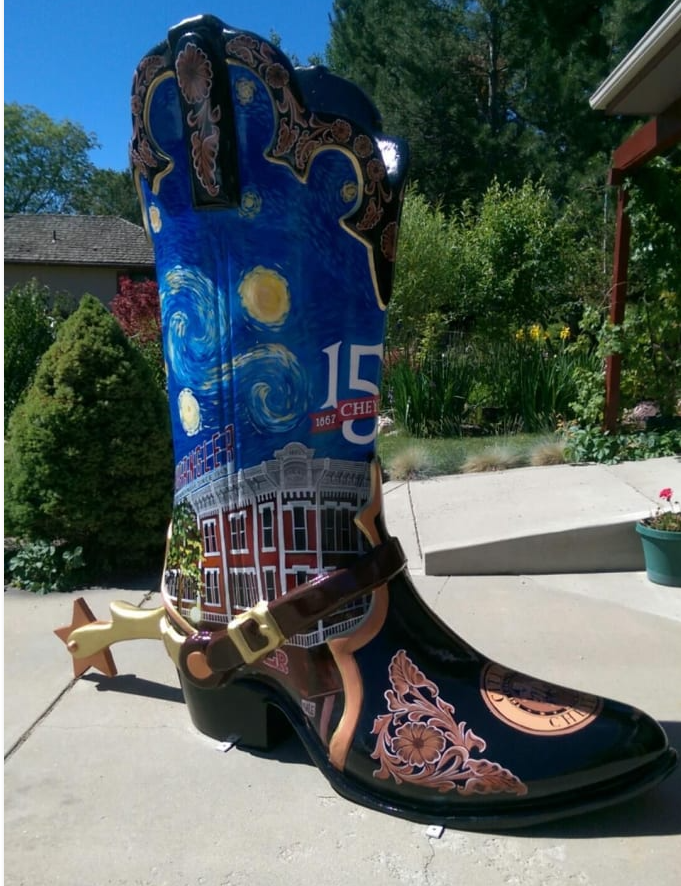 ^' cowbot boot painted with the Wrangler building and a Van Gogh-style Starry Night background.