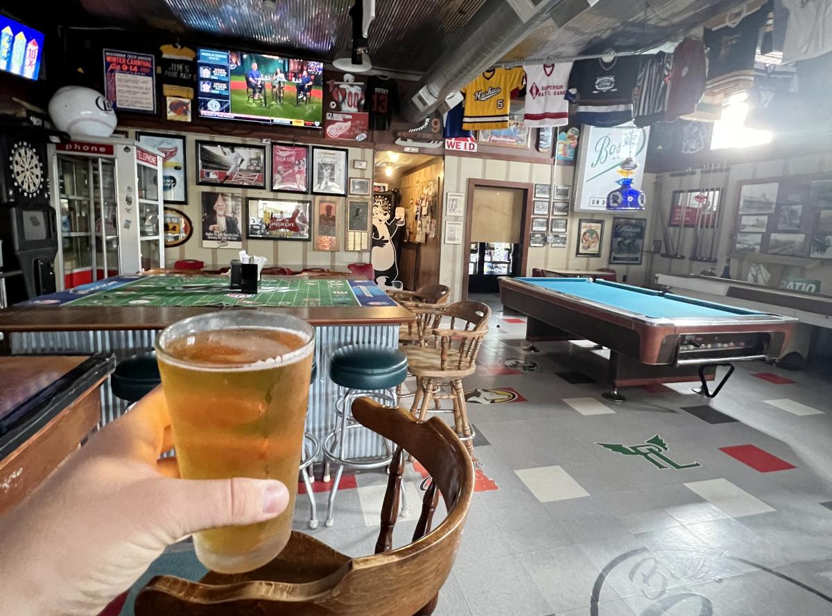 Picture holding beer in bar