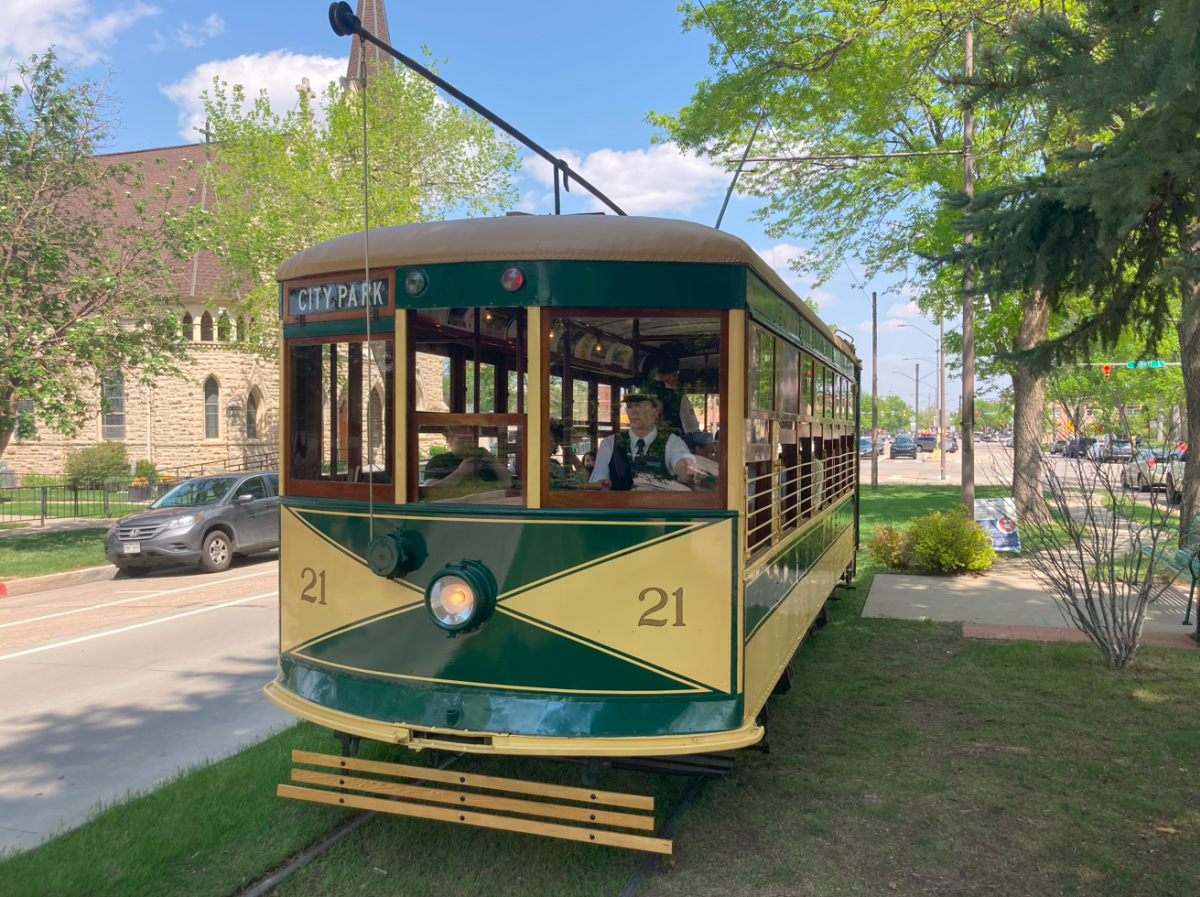 Car 21 going to city park with conductor in driver's seat