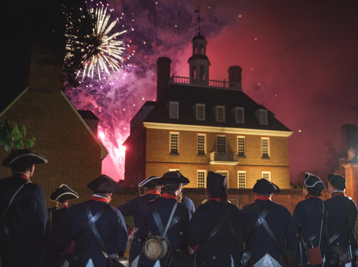 Colonial soldiers watching fireworks go off on the 4th of July