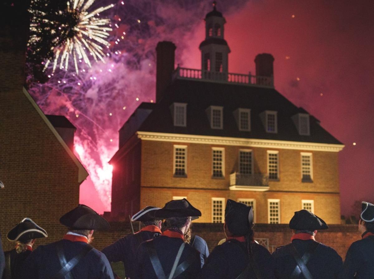 Colonial soldiers watching fireworks go off on the 4th of July
