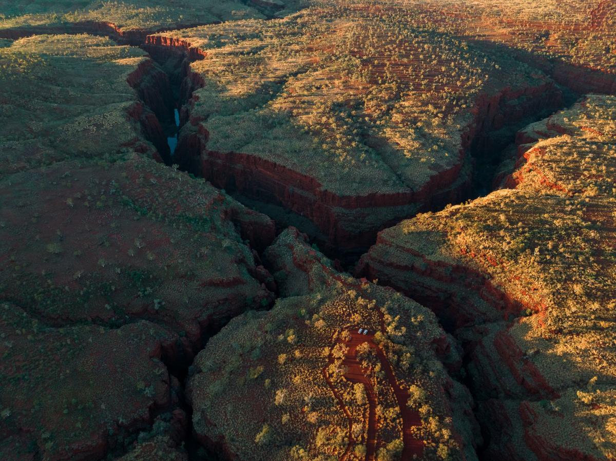 An aerial view of gorges in Karijini, showing the junction of several deep cut gorges