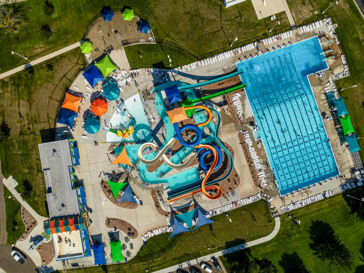 Family feeds fish at Ward Meade Botanical Garden in Topeka