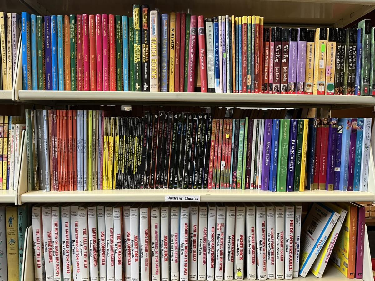 Books sit on shelves for purchase at ICT Books