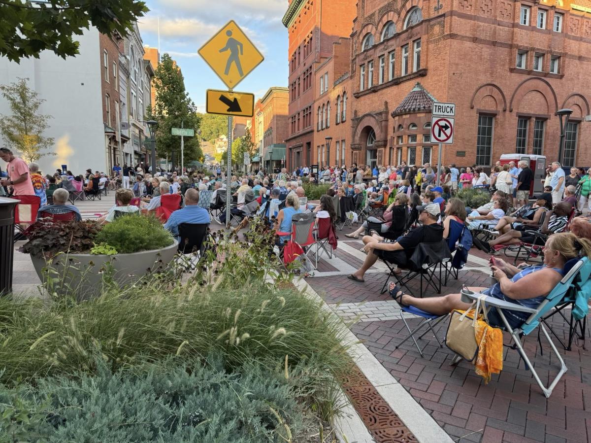 A large crowd gathers along the downtown street in Cumberland, MD, for live music at Friday After Five.