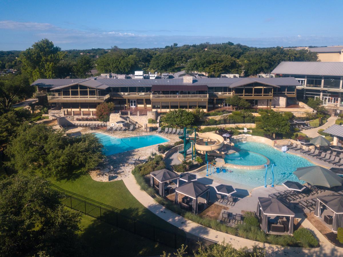 Aerial image of the outdoor pools and cabanas at Lakeway Resort & Spa.