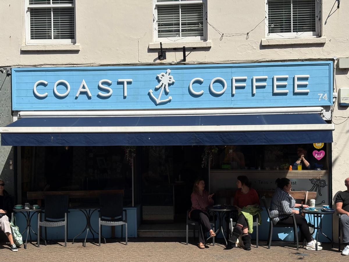 People sitting outside Coast Coffee